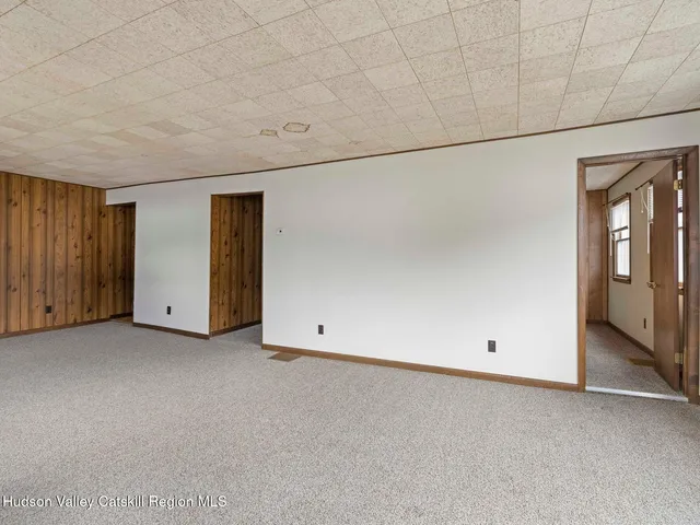 a view of an empty room with windows