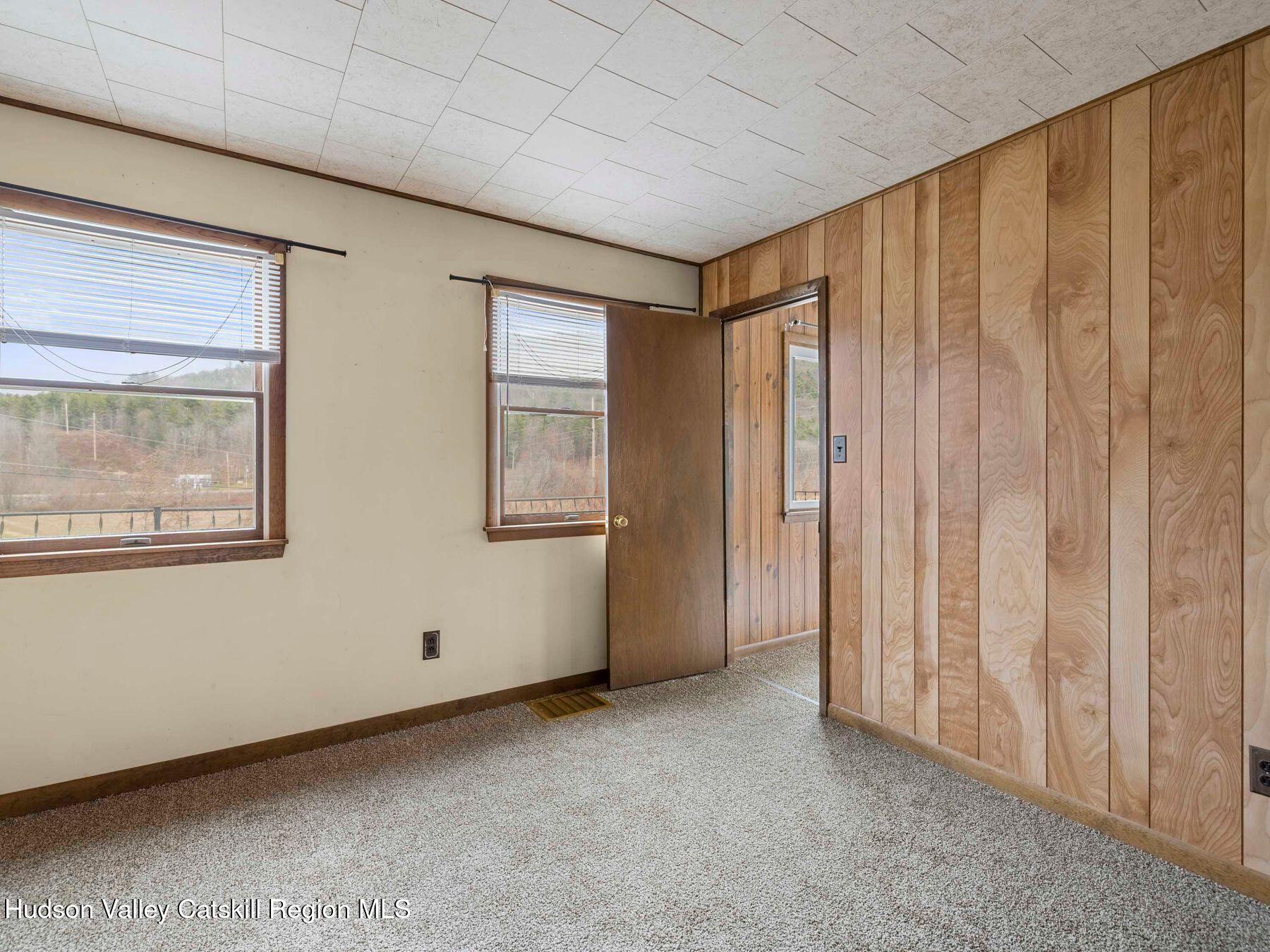 169 Mattice Road Prattsville, NY 12468 - Photo 37 of 52 a view of an empty room with a window