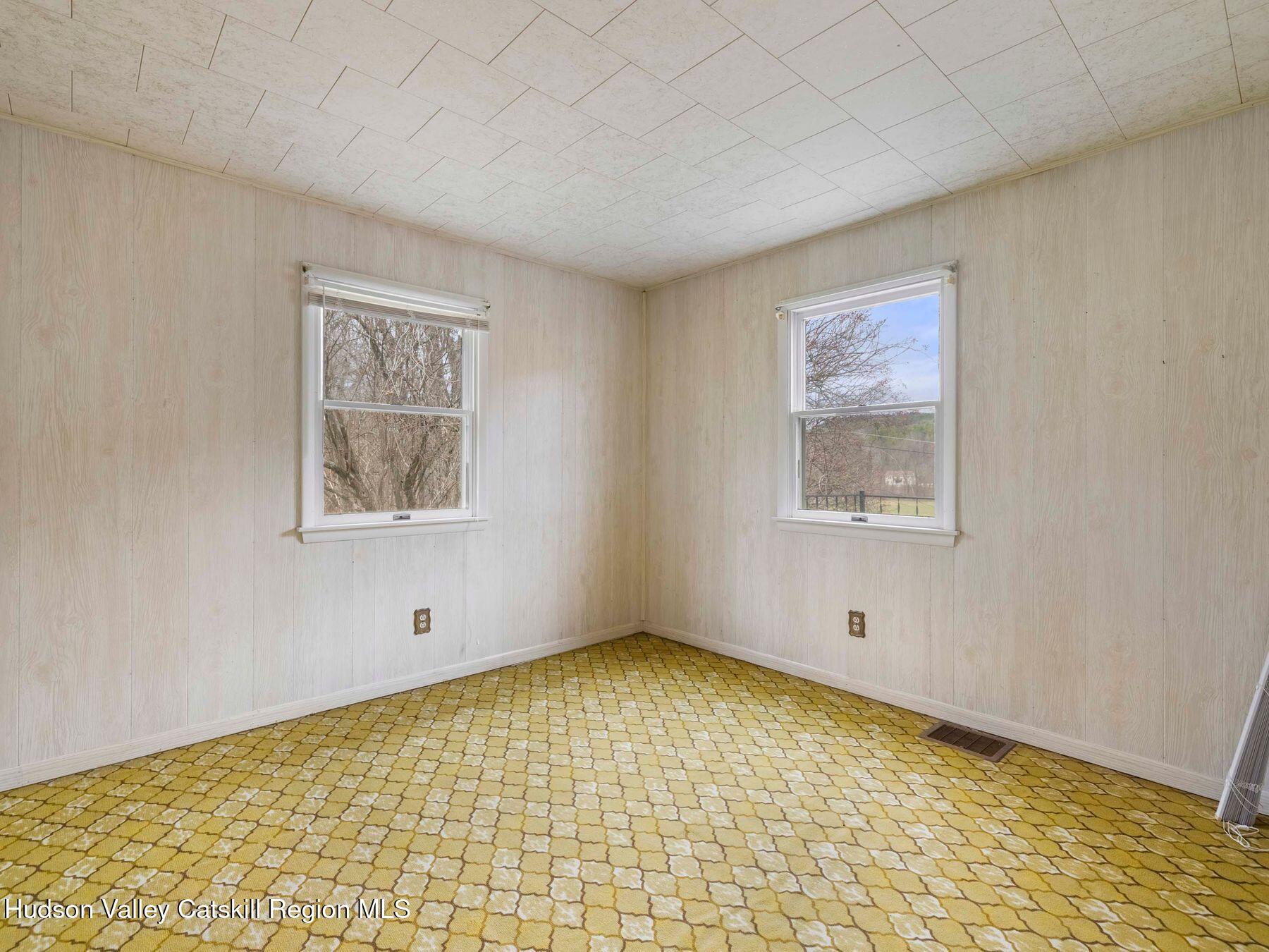 169 Mattice Road Prattsville, NY 12468 - Photo 38 of 52 a view of an empty room with a window
