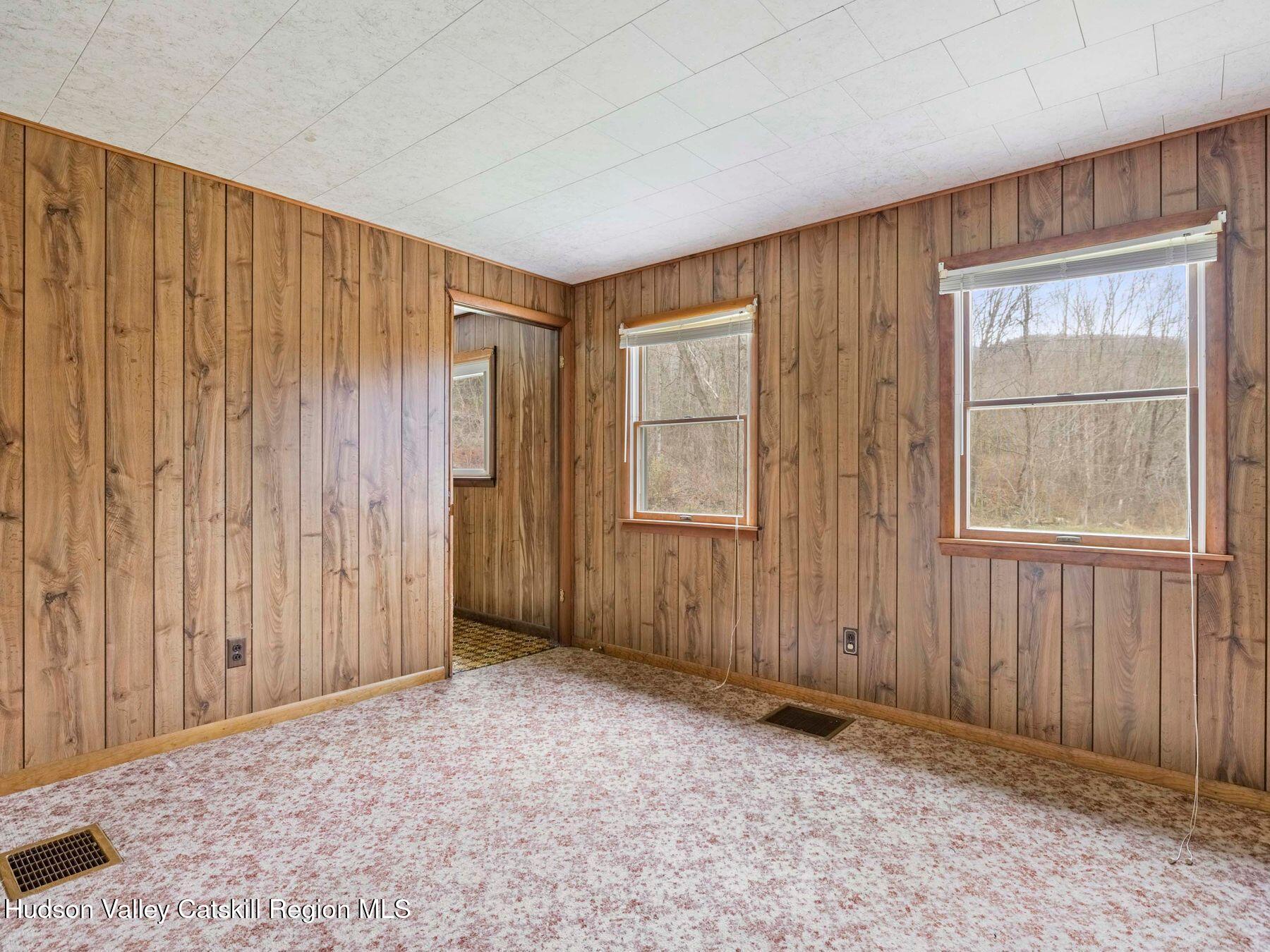 169 Mattice Road Prattsville, NY 12468 - Photo 40 of 52 an empty room with windows