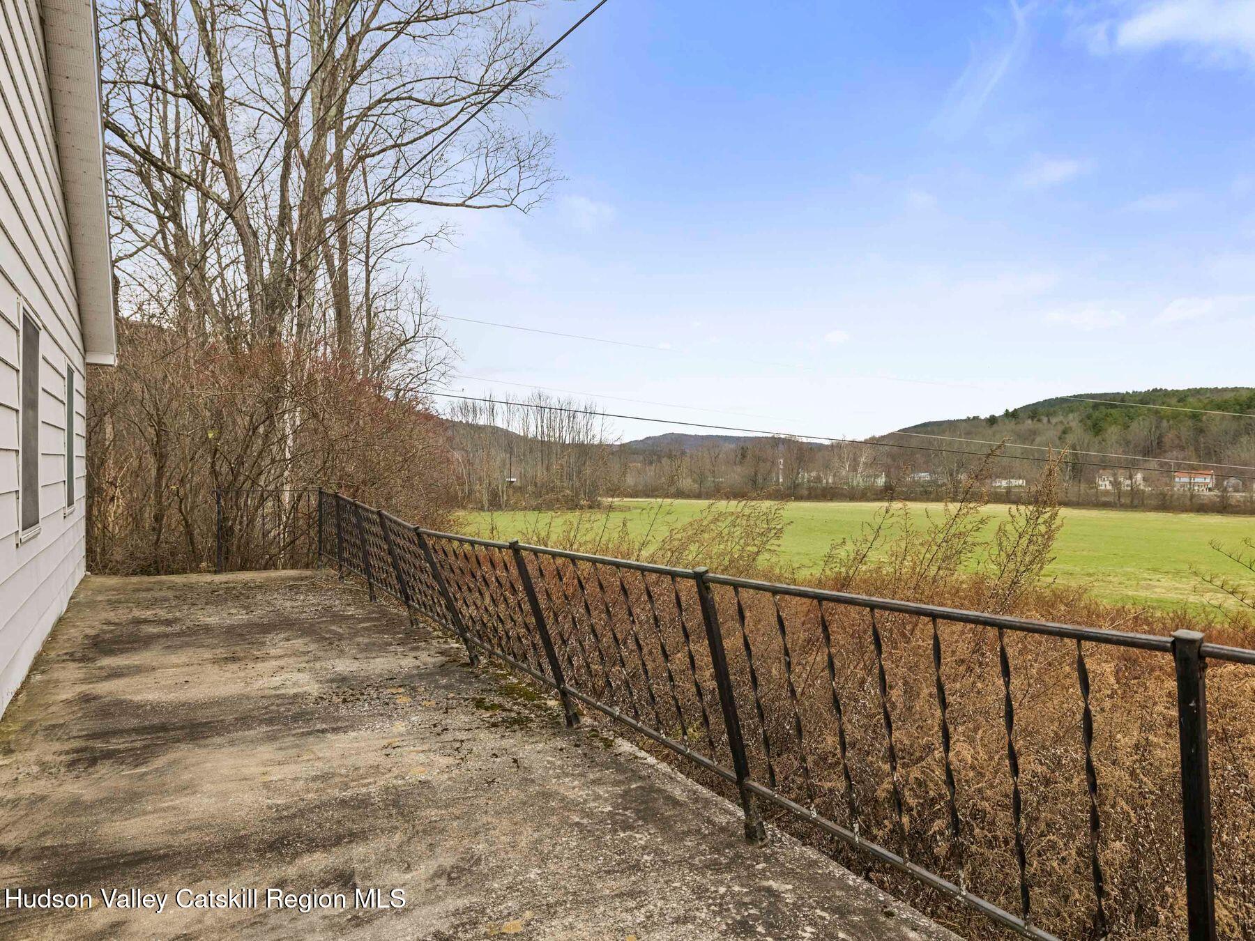 169 Mattice Road Prattsville, NY 12468 - Photo 42 of 52 a view of balcony with wooden floor and fence