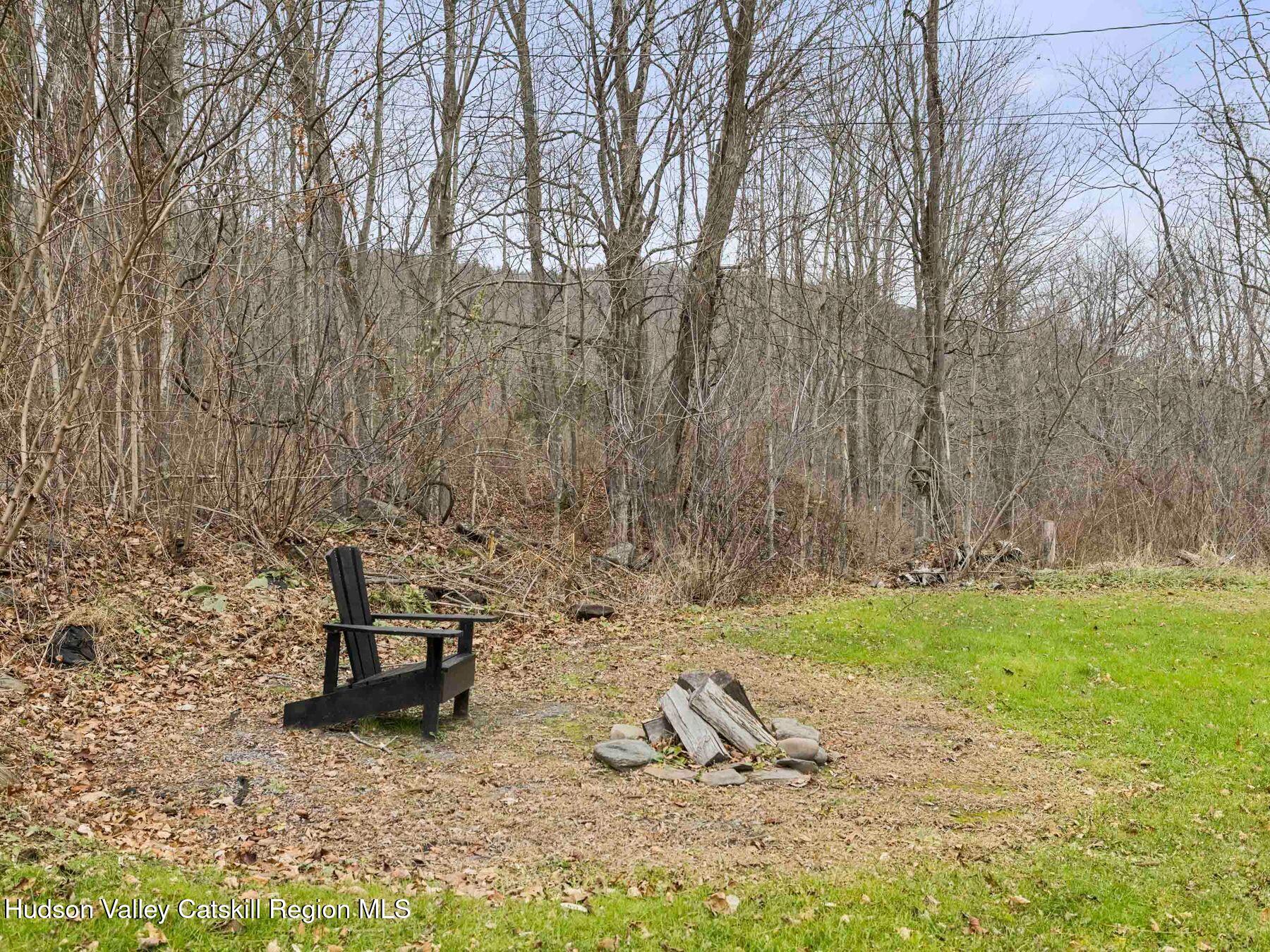169 Mattice Road Prattsville, NY 12468 - Photo 44 of 52 a view of a bench in a backyard