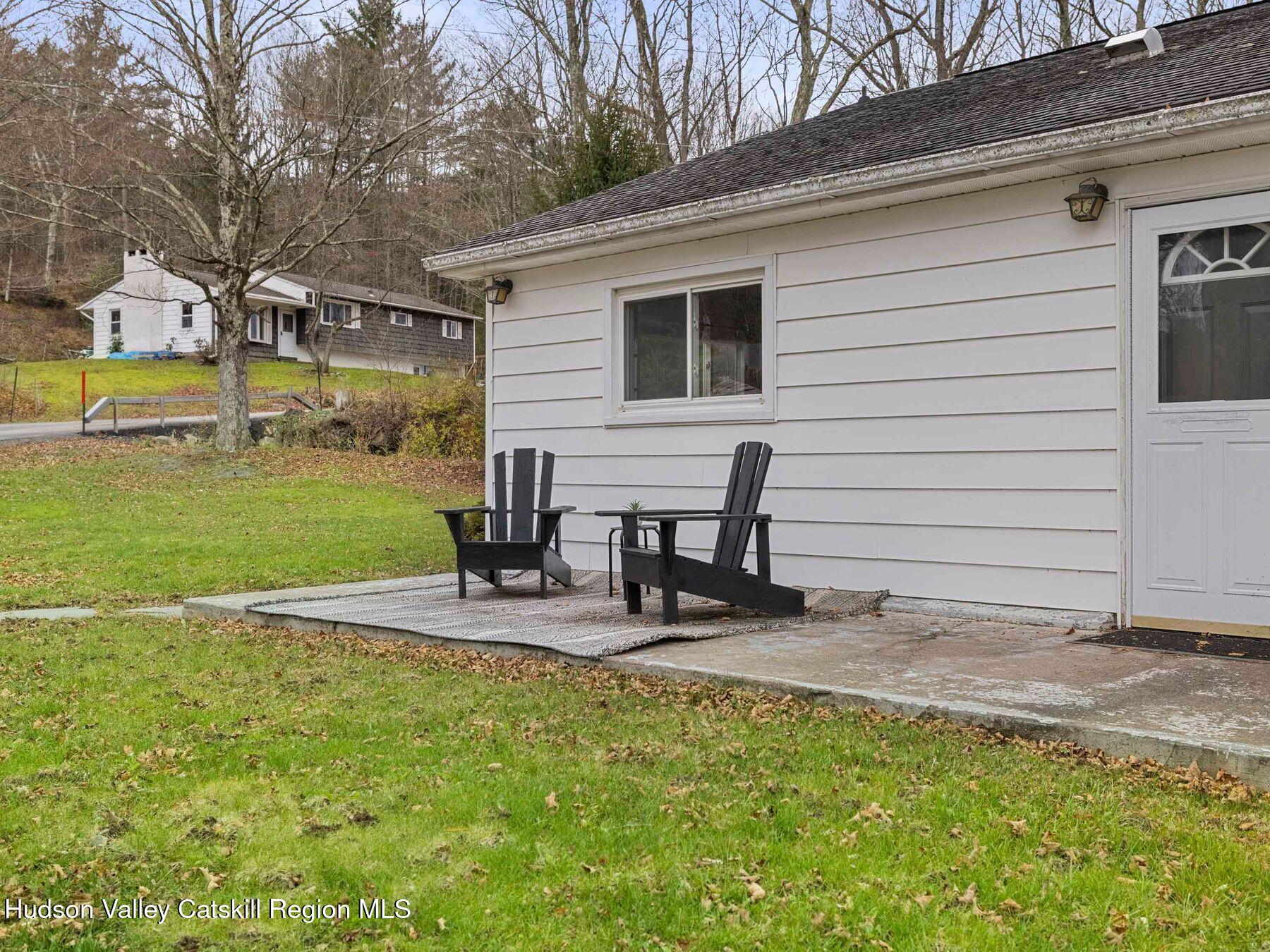 169 Mattice Road Prattsville, NY 12468 - Photo 8 of 52 a view of a patio with table and chairs near a barbeque