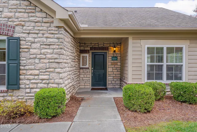 a front view of a house with a garage