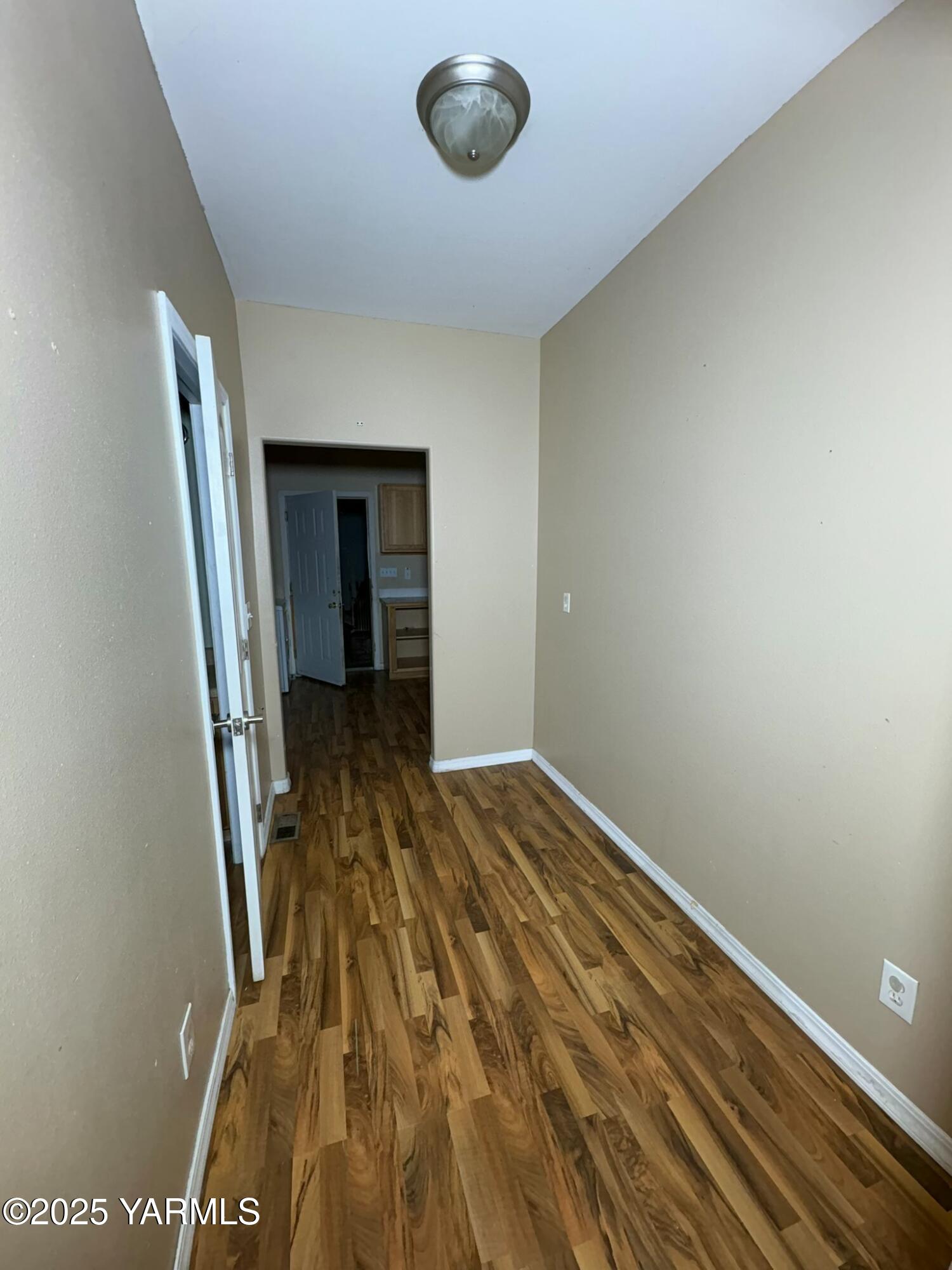 359 Riggins Road Wapato, WA 98951 - Photo 12 of 16 a view of a livingroom with wooden floor and staircase