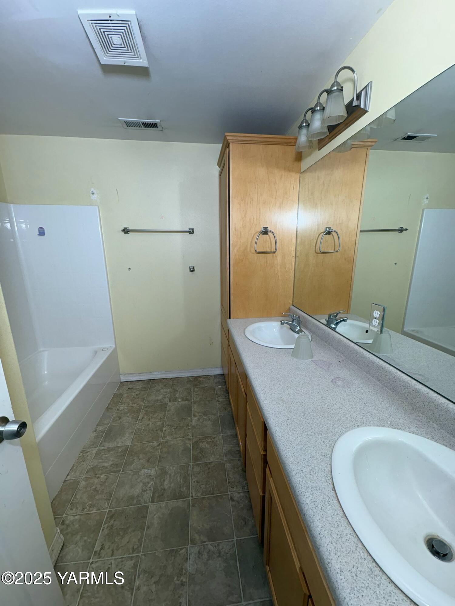 359 Riggins Road Wapato, WA 98951 - Photo 13 of 16 a bathroom with a sink and a mirror