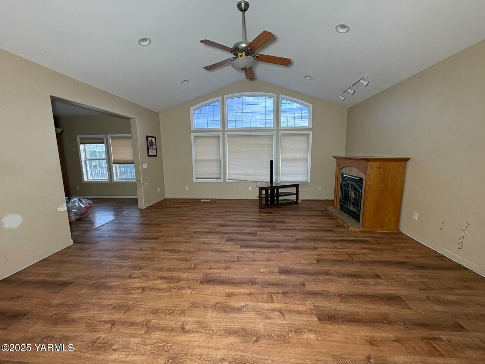 359 Riggins Road Wapato, WA 98951 - Photo 9 of 16 a view of a room with wooden floor and a ceiling fan