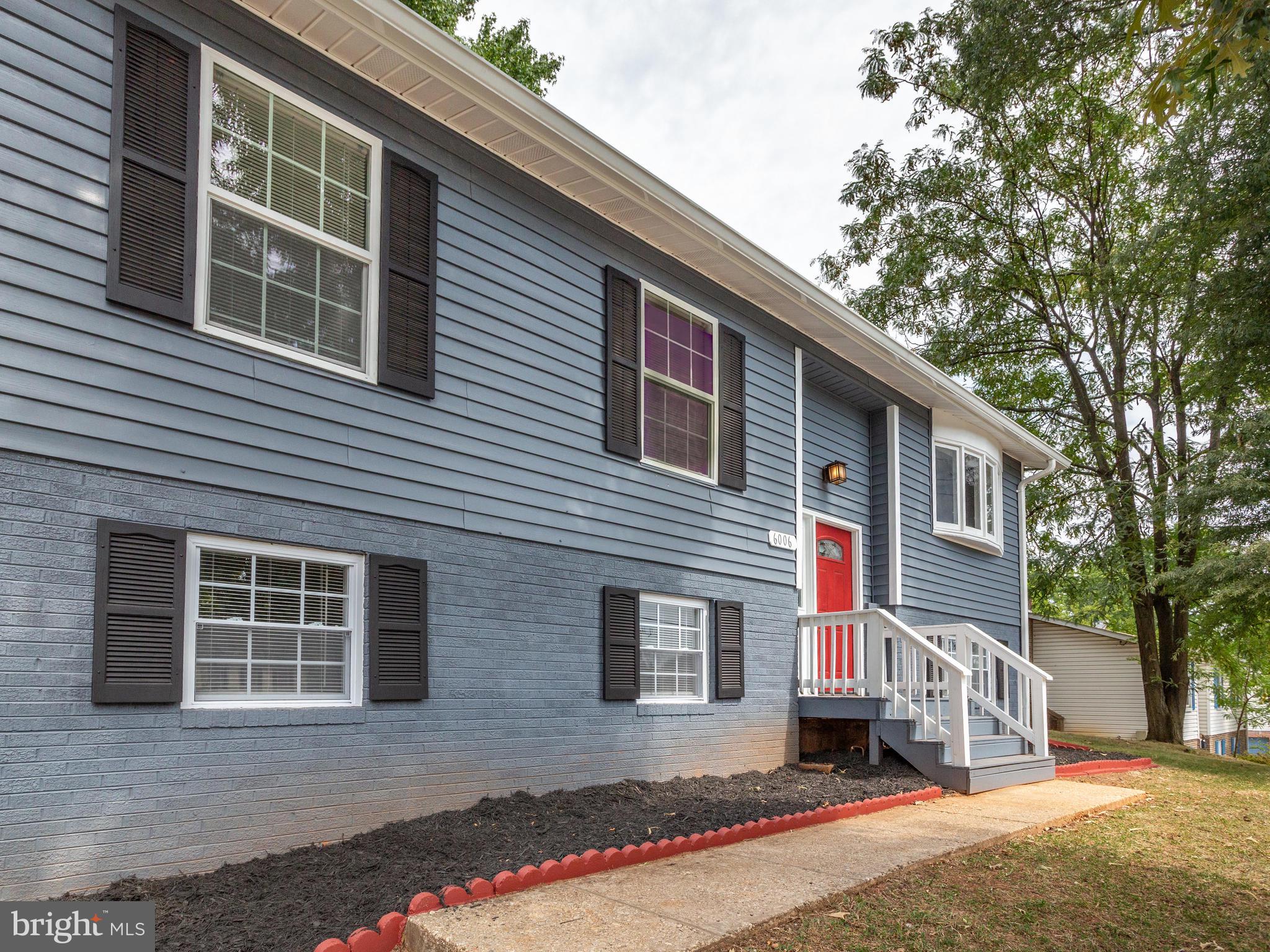6006 Queens Chapel Road Hyattsville, MD 20782 - Photo 2 of 19 a front view of a house with a yard