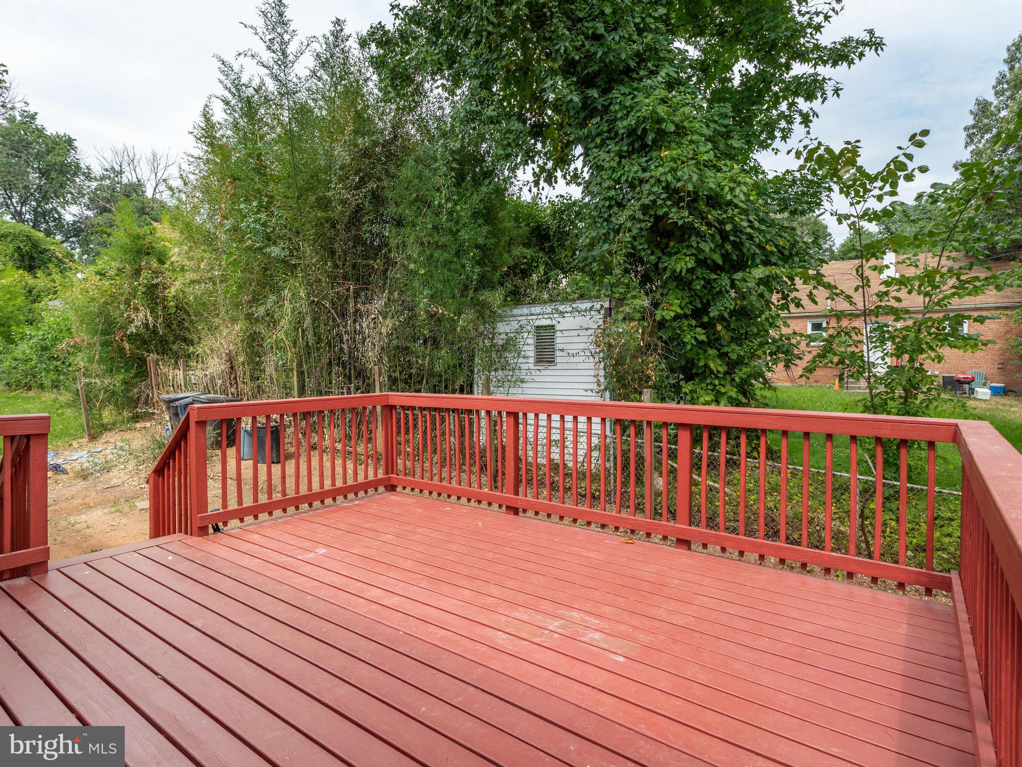 6006 Queens Chapel Road Hyattsville, MD 20782 - Photo 19 of 19 a balcony with wooden floor and fence