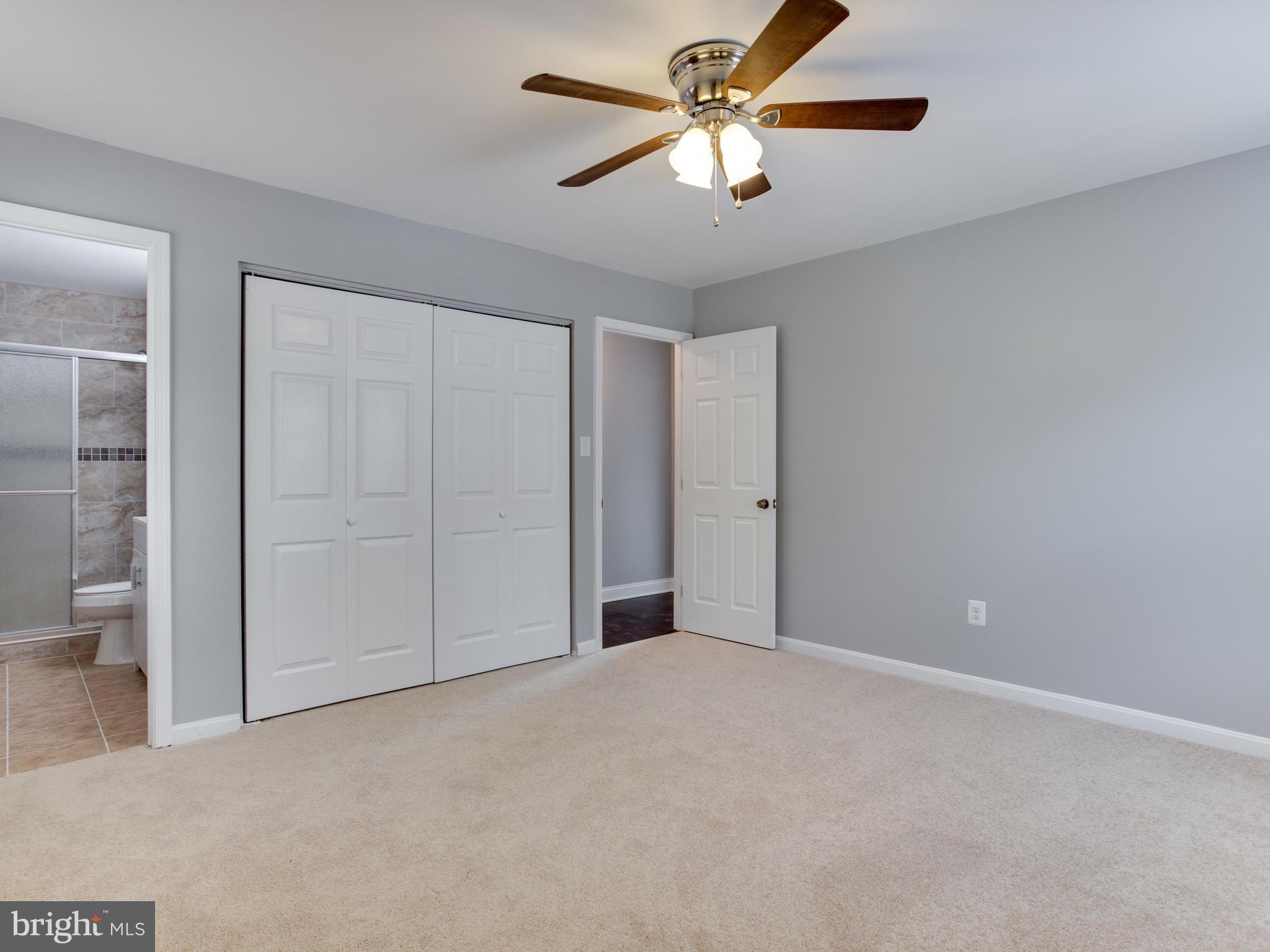 6006 Queens Chapel Road Hyattsville, MD 20782 - Photo 10 of 19 an empty room with closet and a chandelier fan