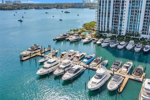 a view of a house with yard and chairs