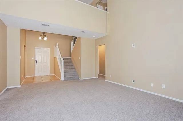 an empty room with a bathroom and a shower