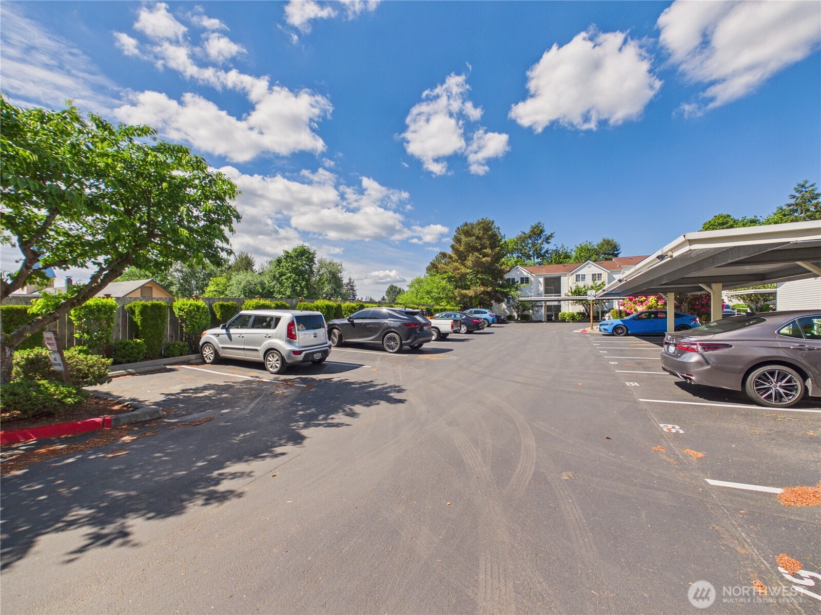 11002 Southeast Petrovitsky Road, Unit I102 Renton, WA 98055 - Photo 23 of 24 a car parked on the side of a street