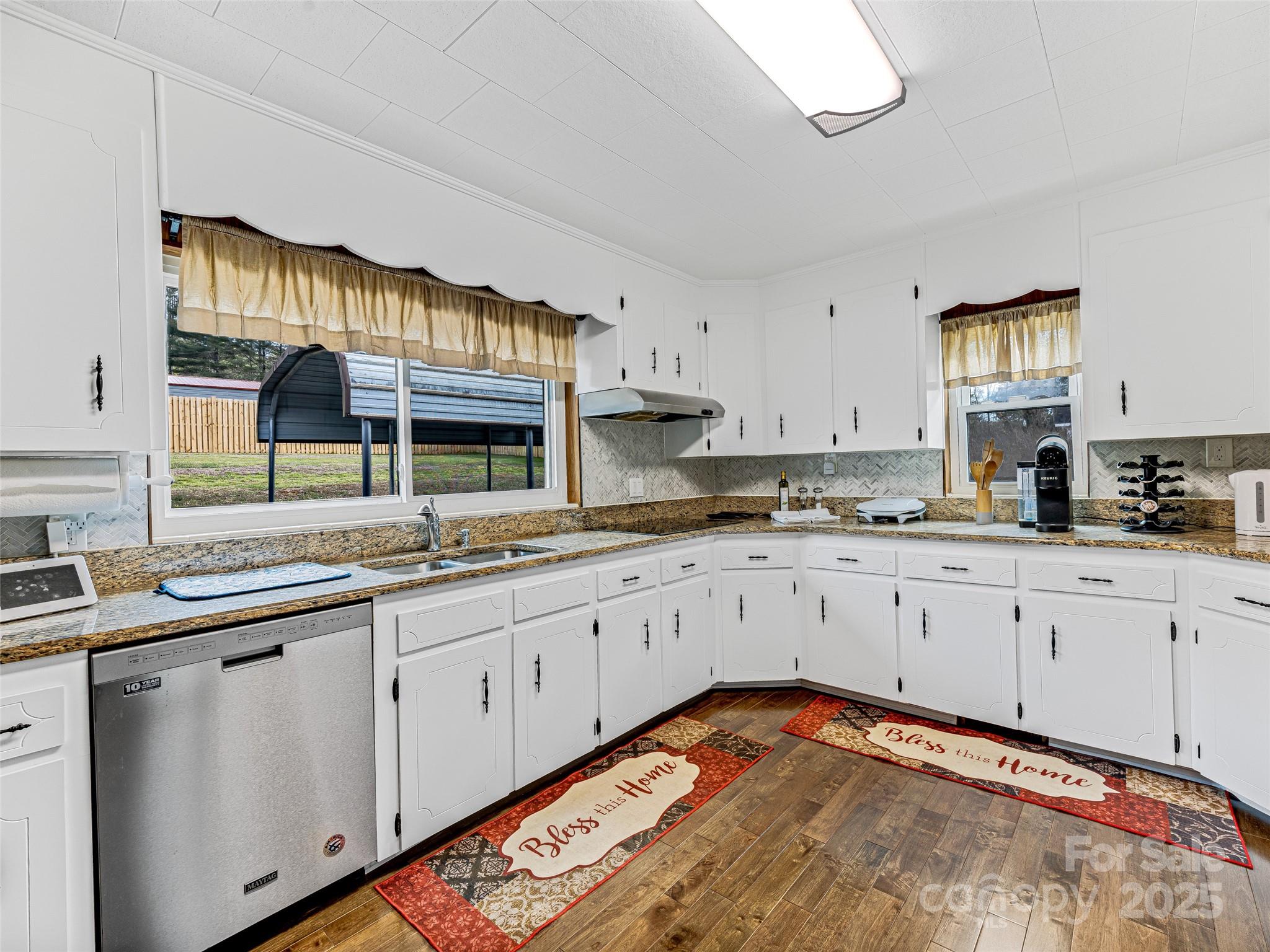 372 Hamilton Road Penrose, NC 28766 - Photo 15 of 38 a kitchen with stainless steel appliances granite countertop a sink and cabinets
