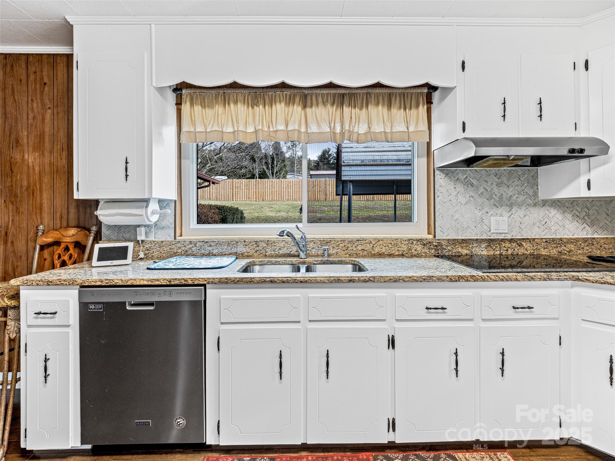 372 Hamilton Road Penrose, NC 28766 - Photo 16 of 38 a kitchen with granite countertop a sink and a stove