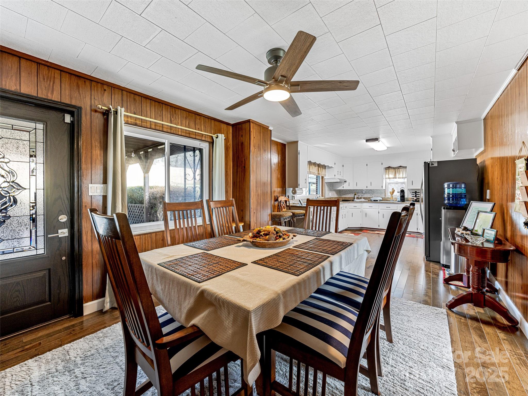372 Hamilton Road Penrose, NC 28766 - Photo 17 of 38 a view of a dining room with furniture window and wooden floor