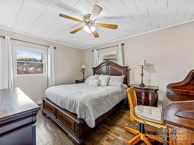 a bedroom with bed and window
