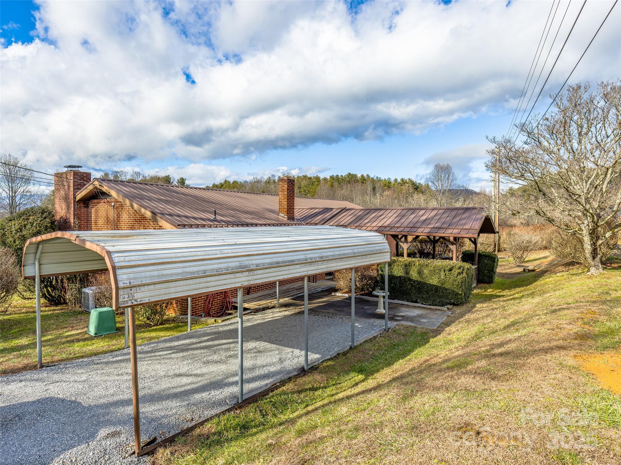 372 Hamilton Road Penrose, NC 28766 - Photo 24 of 38 a view of a house with a balcony and wooden fence