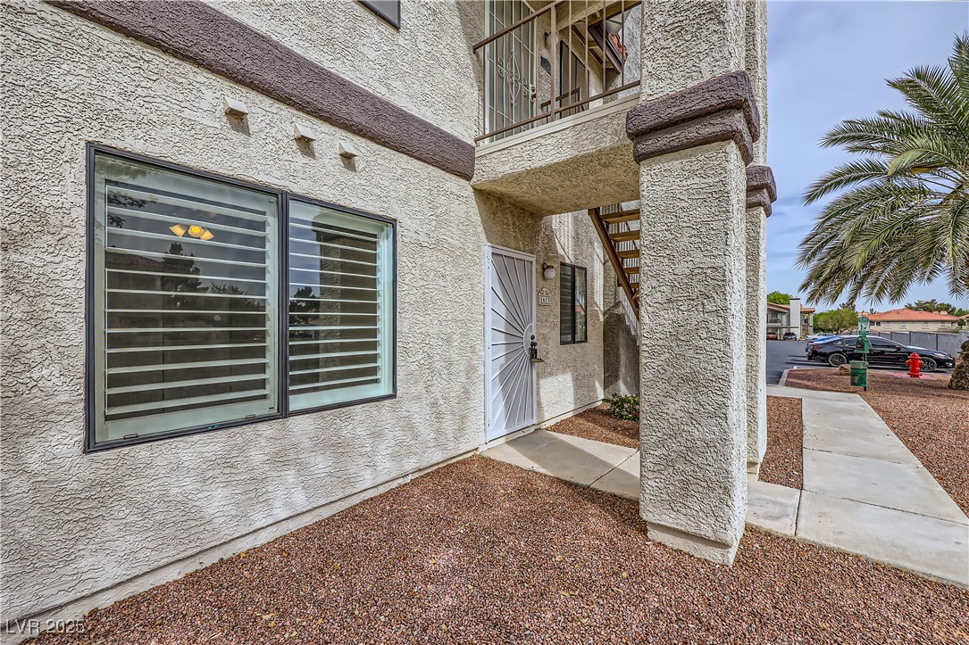 1575 West Warm Springs Road, Unit 1613 Henderson, NV 89014 - Photo 5 of 39 Doorway to property with stucco siding