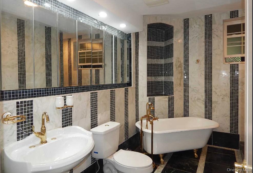 9 Tower Hill Road Shoreham, NY 11786 - Photo 22 of 41 Pedestal sink, elegant tub and separate shower