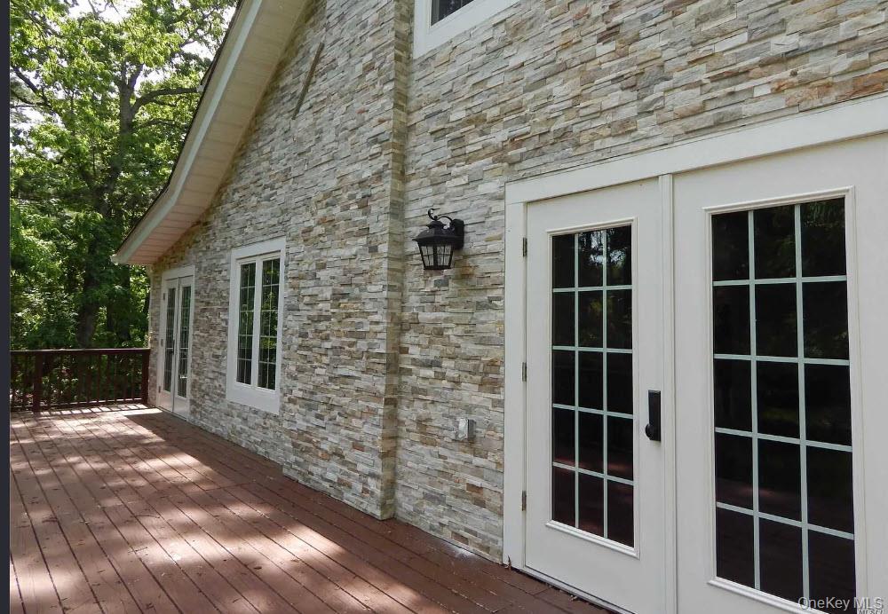 9 Tower Hill Road Shoreham, NY 11786 - Photo 24 of 41 Ground level Deck off Formal Dining Room