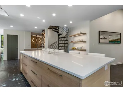 a view of kitchen with stainless steel appliances cabinets