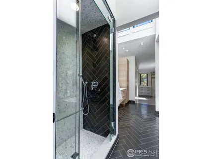 a bathroom with a granite countertop sink toilet a mirror and bathtub