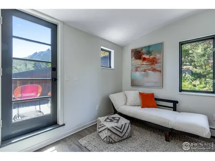 a view of balcony with wooden floor