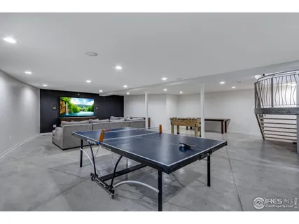 a view of a room with furniture and a couch