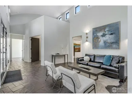 a living room with furniture and a rug