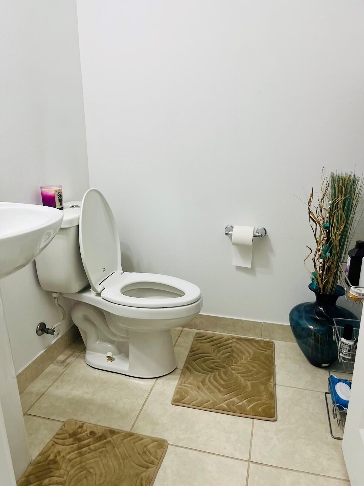 5211 Northwest 50th Terrace Tamarac, FL 33319 - Photo 12 of 15 a bathroom with a toilet and a shower