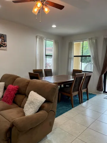 a living room with furniture and a table