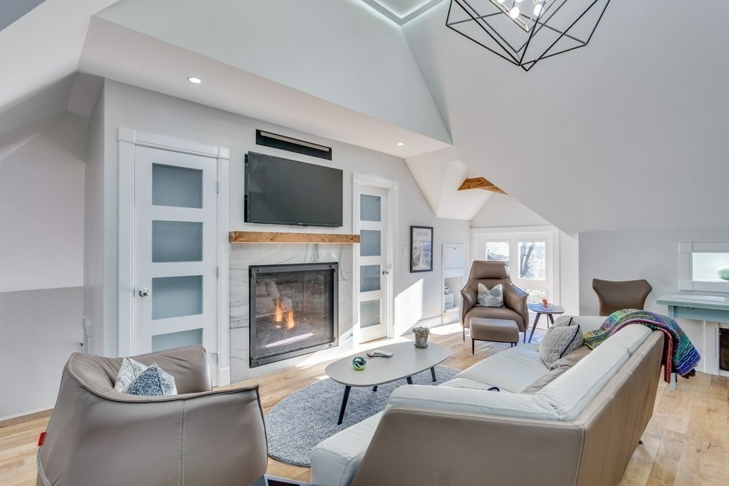7 Brewer Street, Unit 2 Boston, MA 02130 - Photo 3 of 18 a living room with furniture and a fireplace