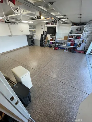 a view of parking garage with cars and other equipment