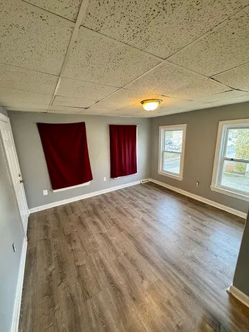 a view of an empty room with windows