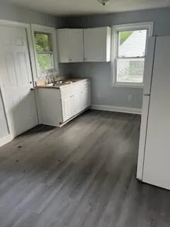 a view of a kitchen with a sink cabinets and a window