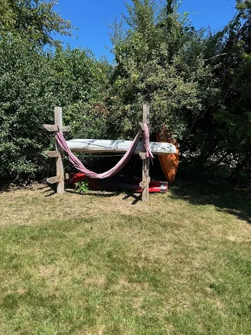 a backyard of a house with trampoline