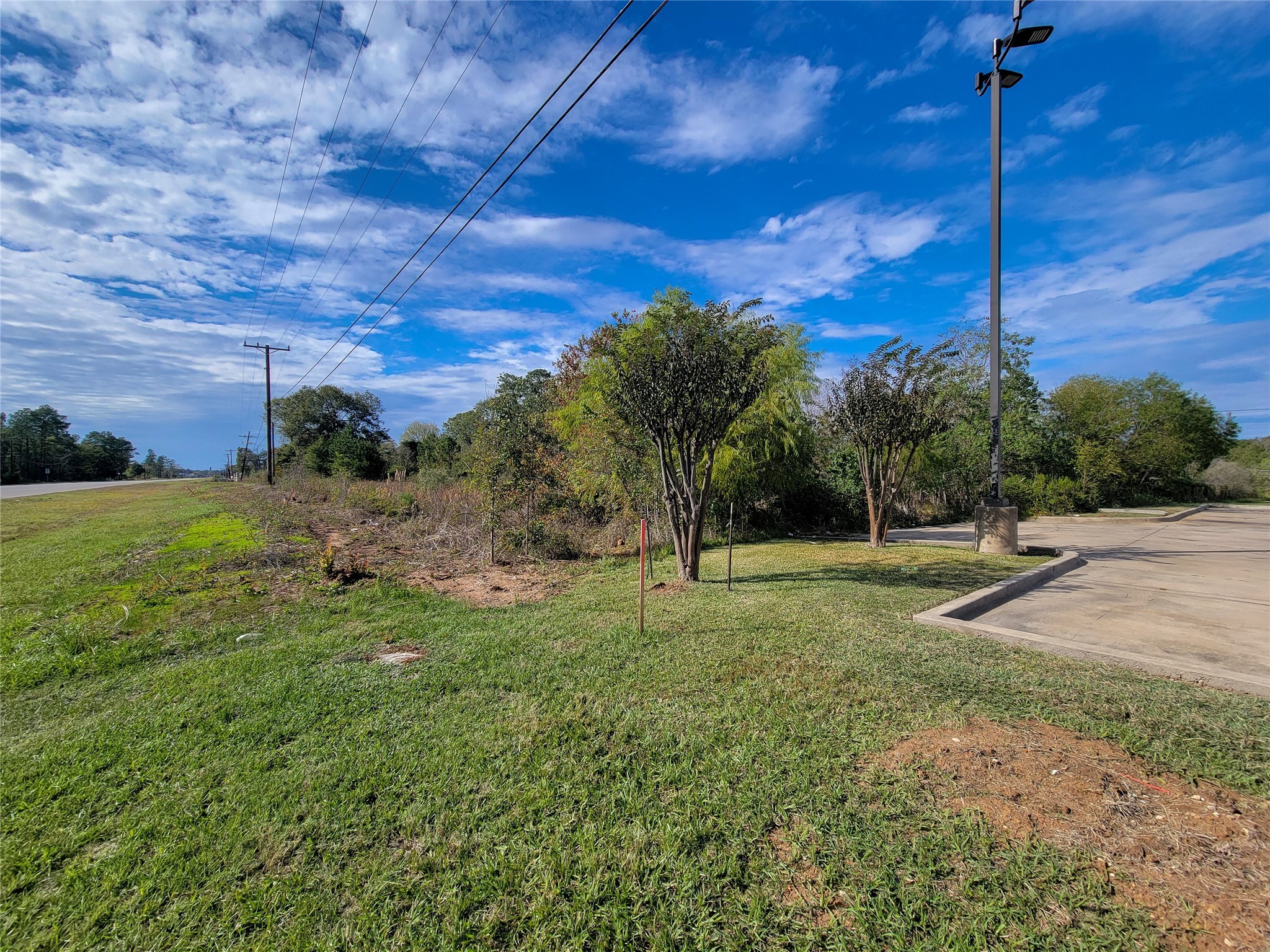 0 Hwy 105 Street Conroe, TX 77301 - Photo 7 of 15 a view of an outdoor space with a lake view