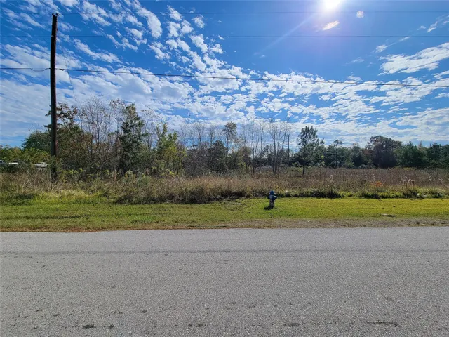 a view of a golf course with a lake