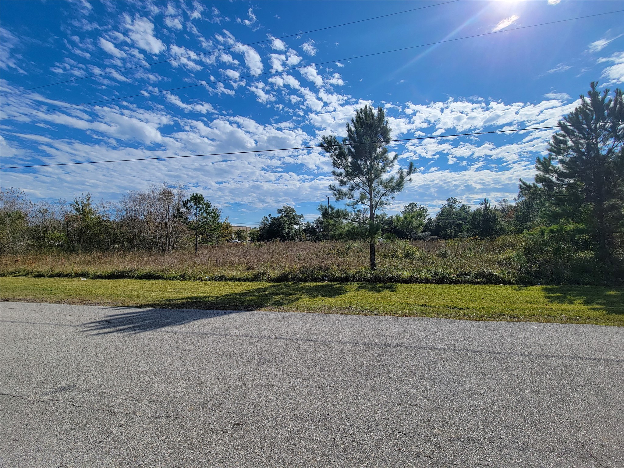 0 Hwy 105 Street Conroe, TX 77301 - Photo 9 of 15 a view of a golf course with a lake