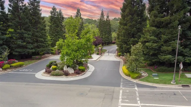 a view of a swimming pool with a yard