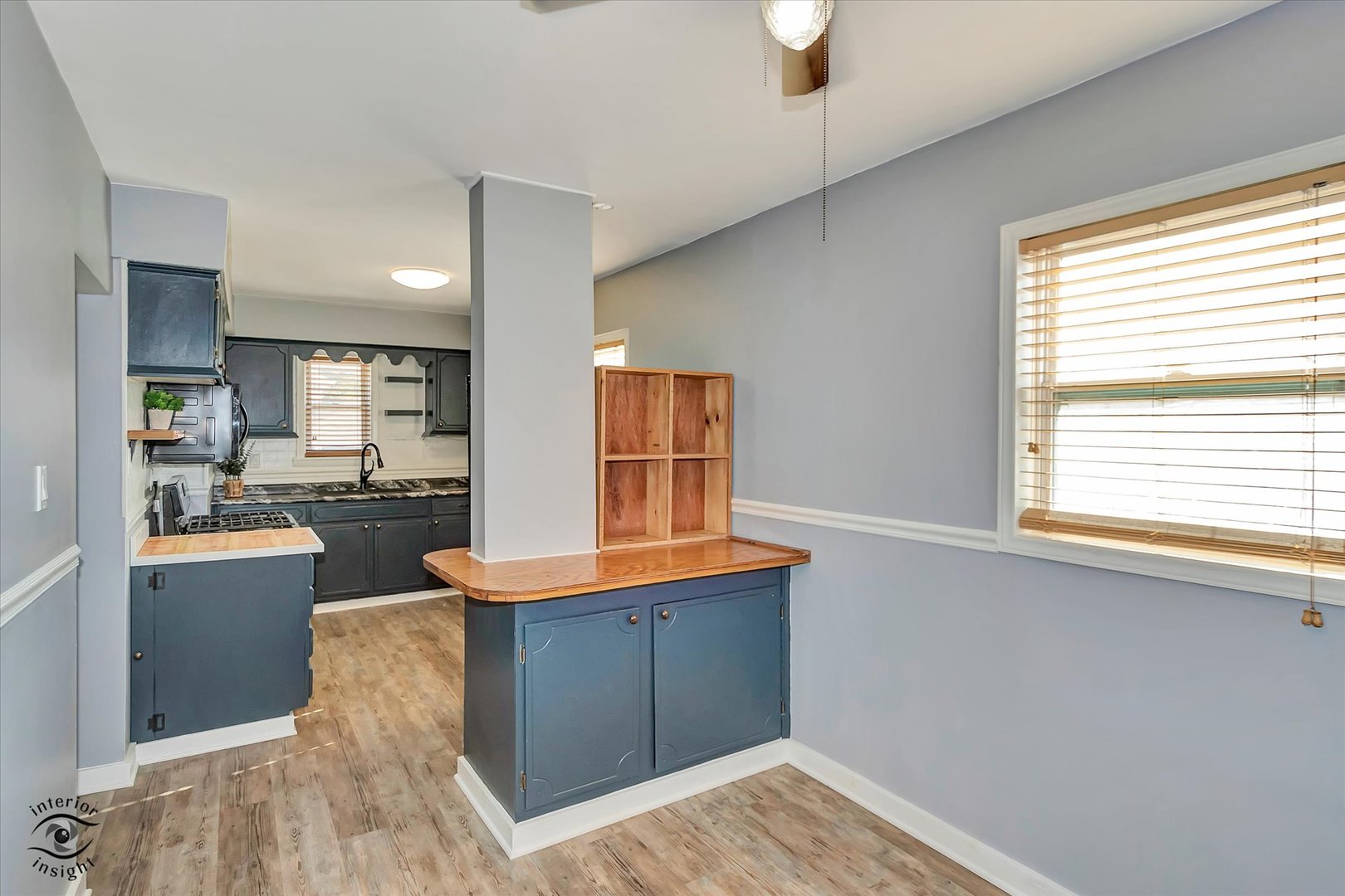 7515 West 61st Street Summit, IL 60501 - Photo 13 of 32 a kitchen with stainless steel appliances granite countertop a stove and a wooden cabinets
