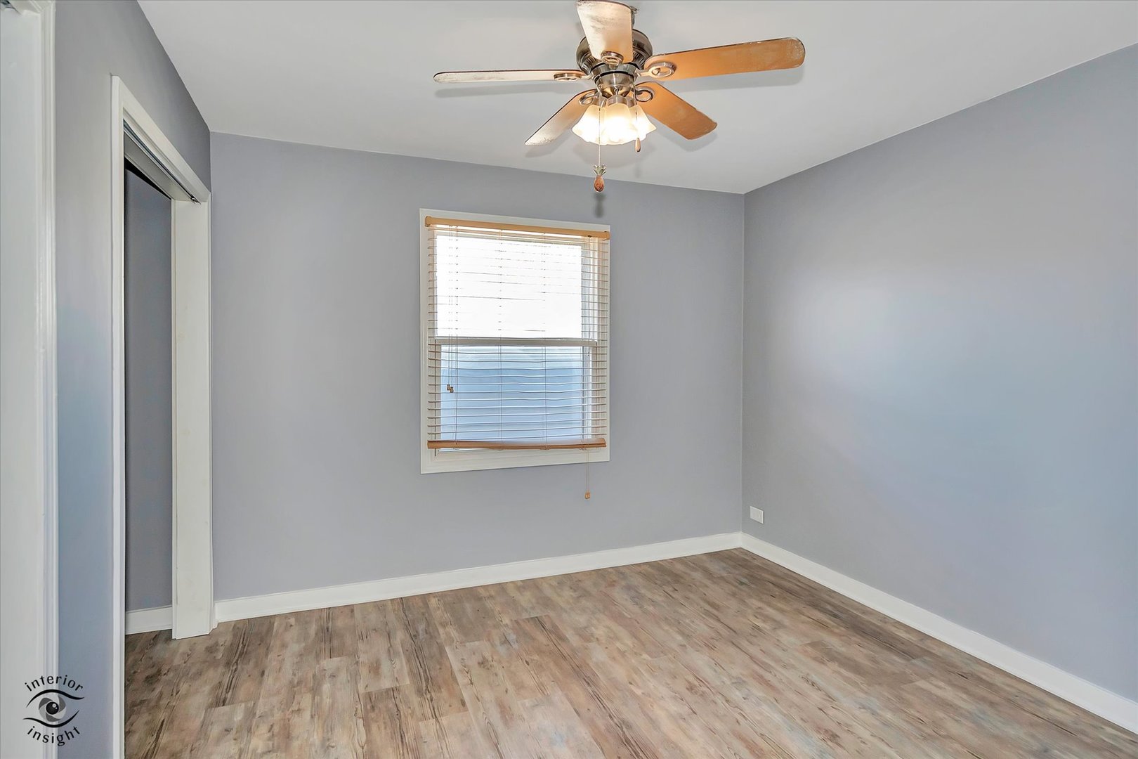 7515 West 61st Street Summit, IL 60501 - Photo 15 of 32 wooden floor in an empty room with a window