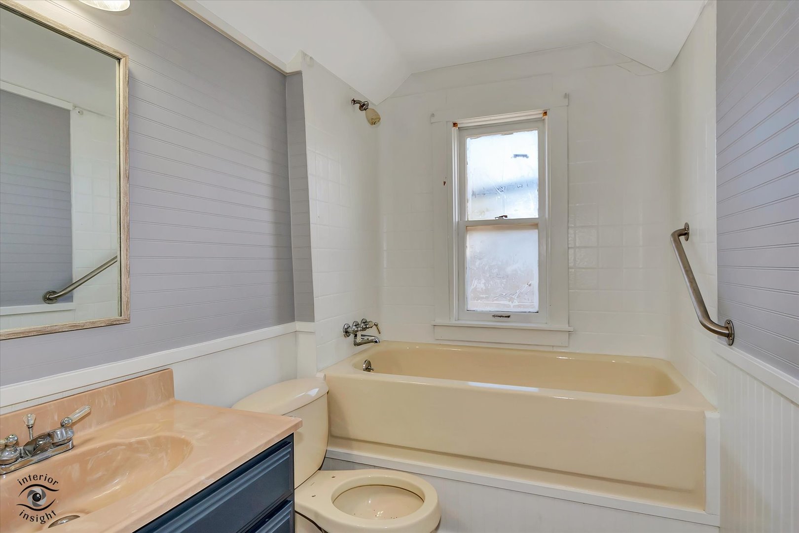 7515 West 61st Street Summit, IL 60501 - Photo 24 of 32 a bathroom with a tub a sink and a window