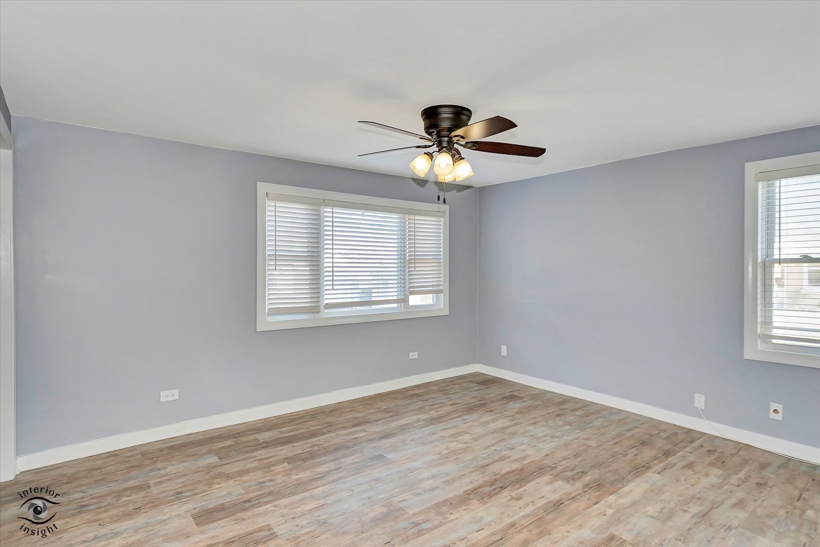 7515 West 61st Street Summit, IL 60501 - Photo 5 of 32 a view of a room with wooden floor and windows