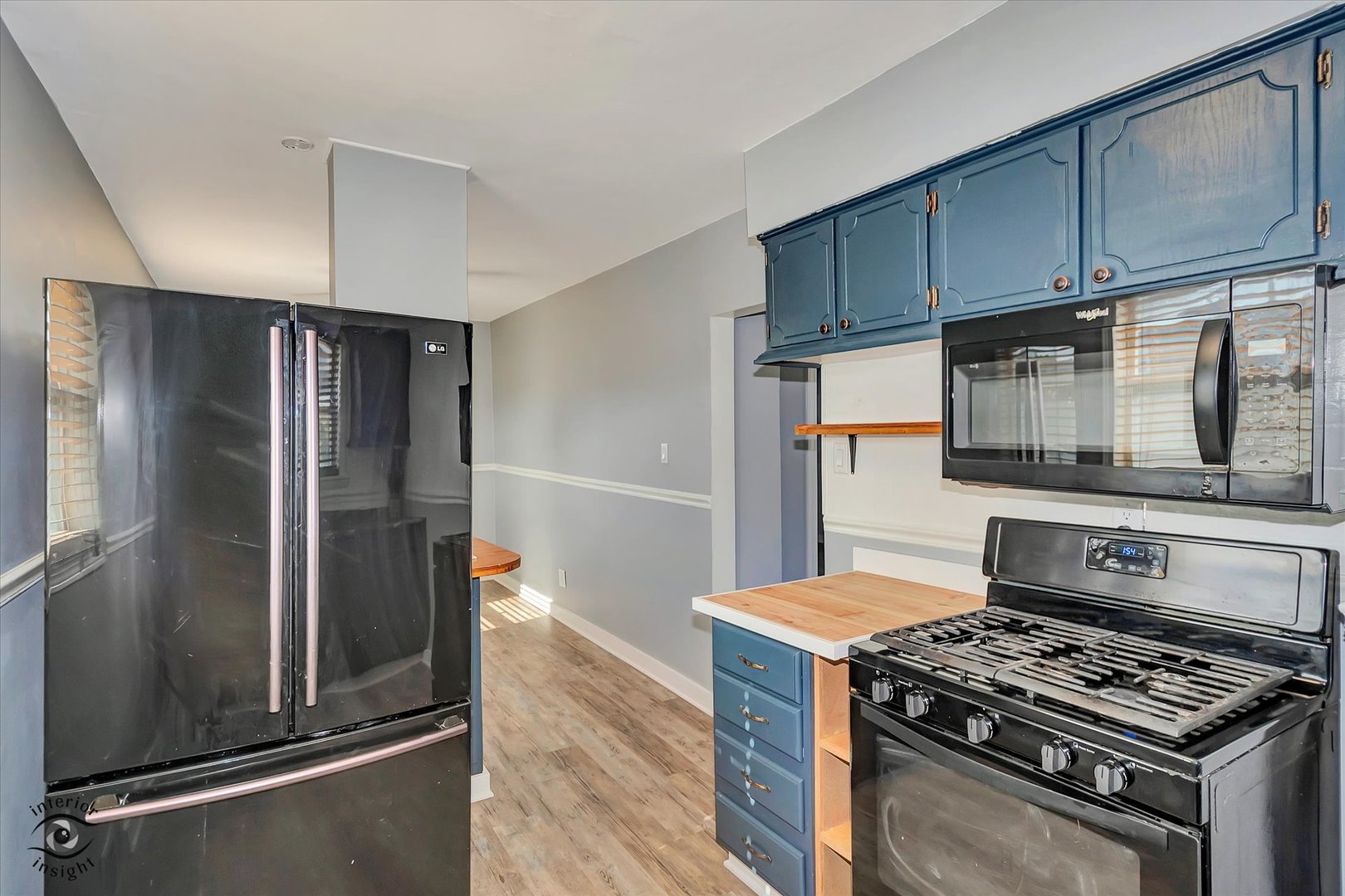 7515 West 61st Street Summit, IL 60501 - Photo 9 of 32 a kitchen with stainless steel appliances granite countertop a stove and a refrigerator