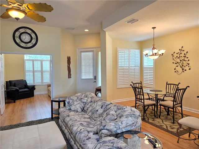 a kitchen with stainless steel appliances a stove a sink a microwave a refrigerator and cabinets