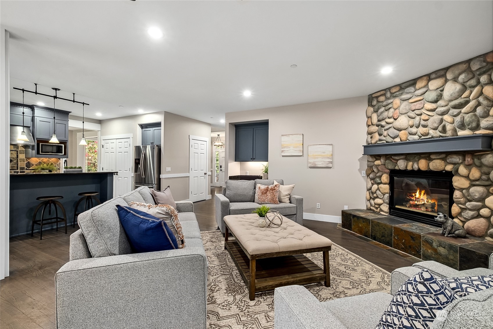24827 247th Place Southeast Maple Valley, WA 98038 - Photo 11 of 33 a living room with furniture and a fireplace
