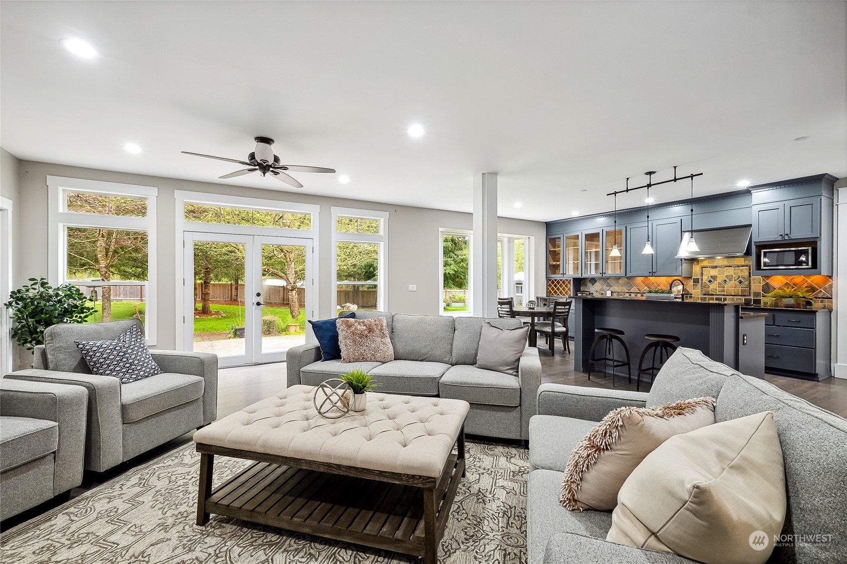 24827 247th Place Southeast Maple Valley, WA 98038 - Photo 14 of 33 a living room with furniture and a large window