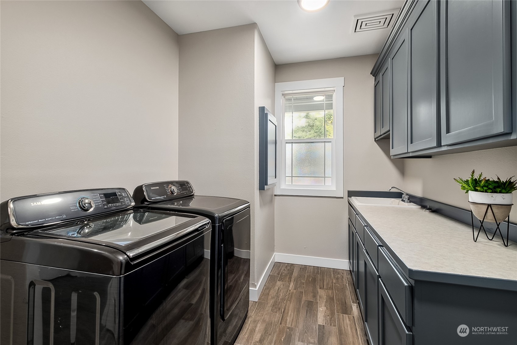 24827 247th Place Southeast Maple Valley, WA 98038 - Photo 17 of 33 a utility room with a stove a sink and a window